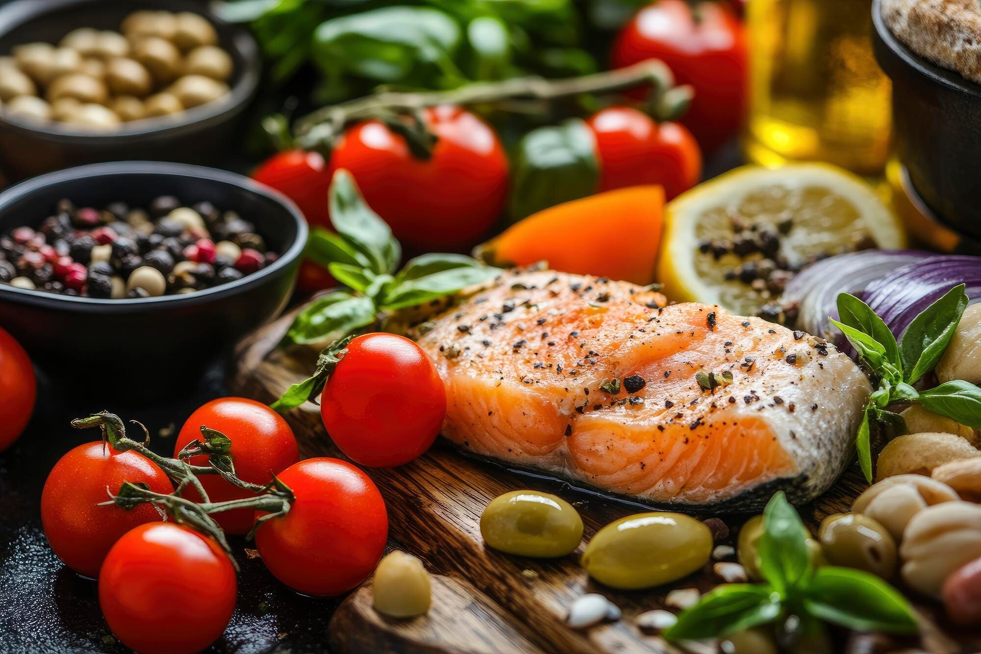 Colourful Mediterranean-style bowl of vegetables, legumes, salmon and olive oil representing an anti-inflammatory eating pattern